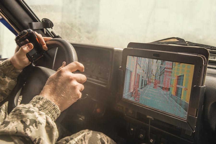 solider driving a vehicle
