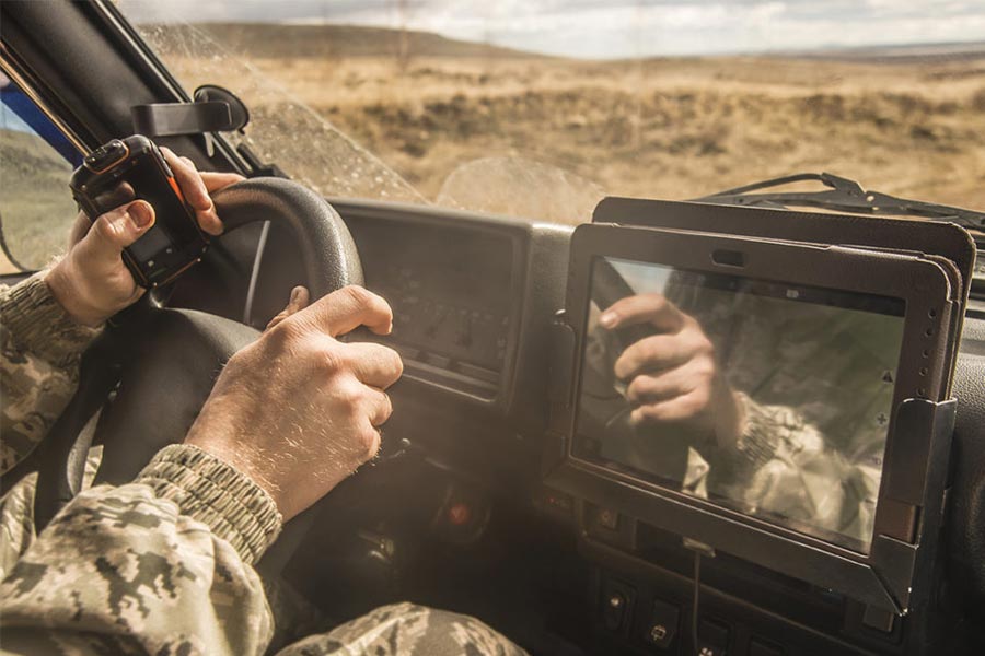 solider driving a vehicle