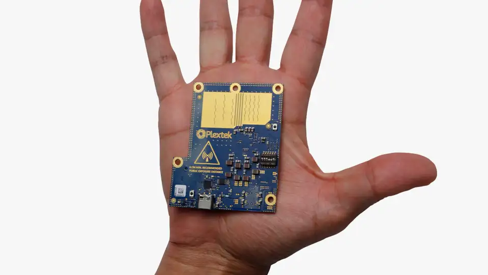 One of our mmWave Radar modules displayed in the palm of a hand showcasing it's low-SWaP