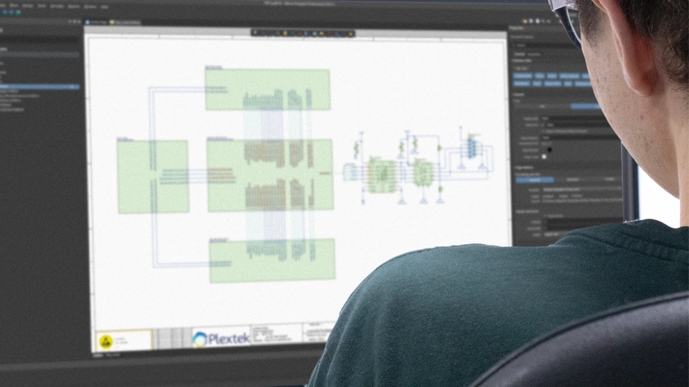A plextek engineer looking at a schematic